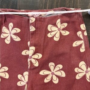 Floral Women's Jeans in brownish rust and Cream large cream floral pattern.